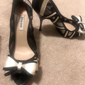 Size 8.5 Dune Black Heels w/ cream satin lining.